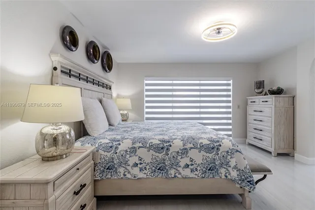 a bedroom with a bed and a table