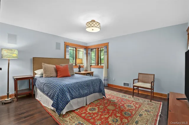 a bedroom with a bed and a lamp on table