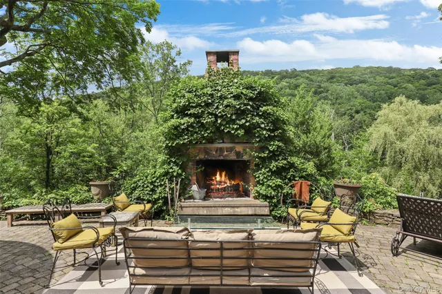 a view of a patio with table and chairs and potted plants