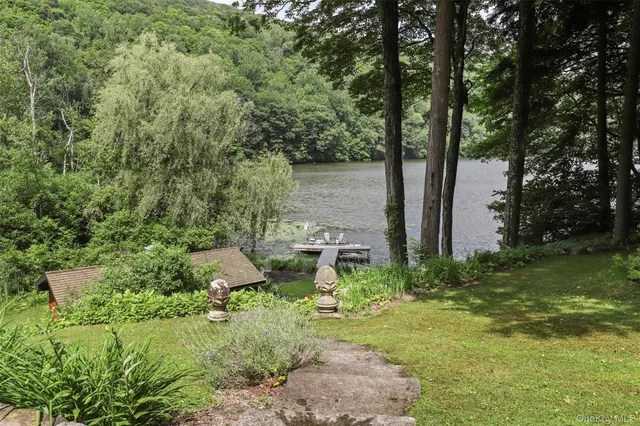 a view of a garden with large trees