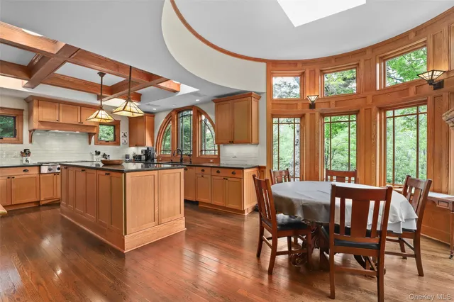 a view of kitchen with furniture and wooden floor