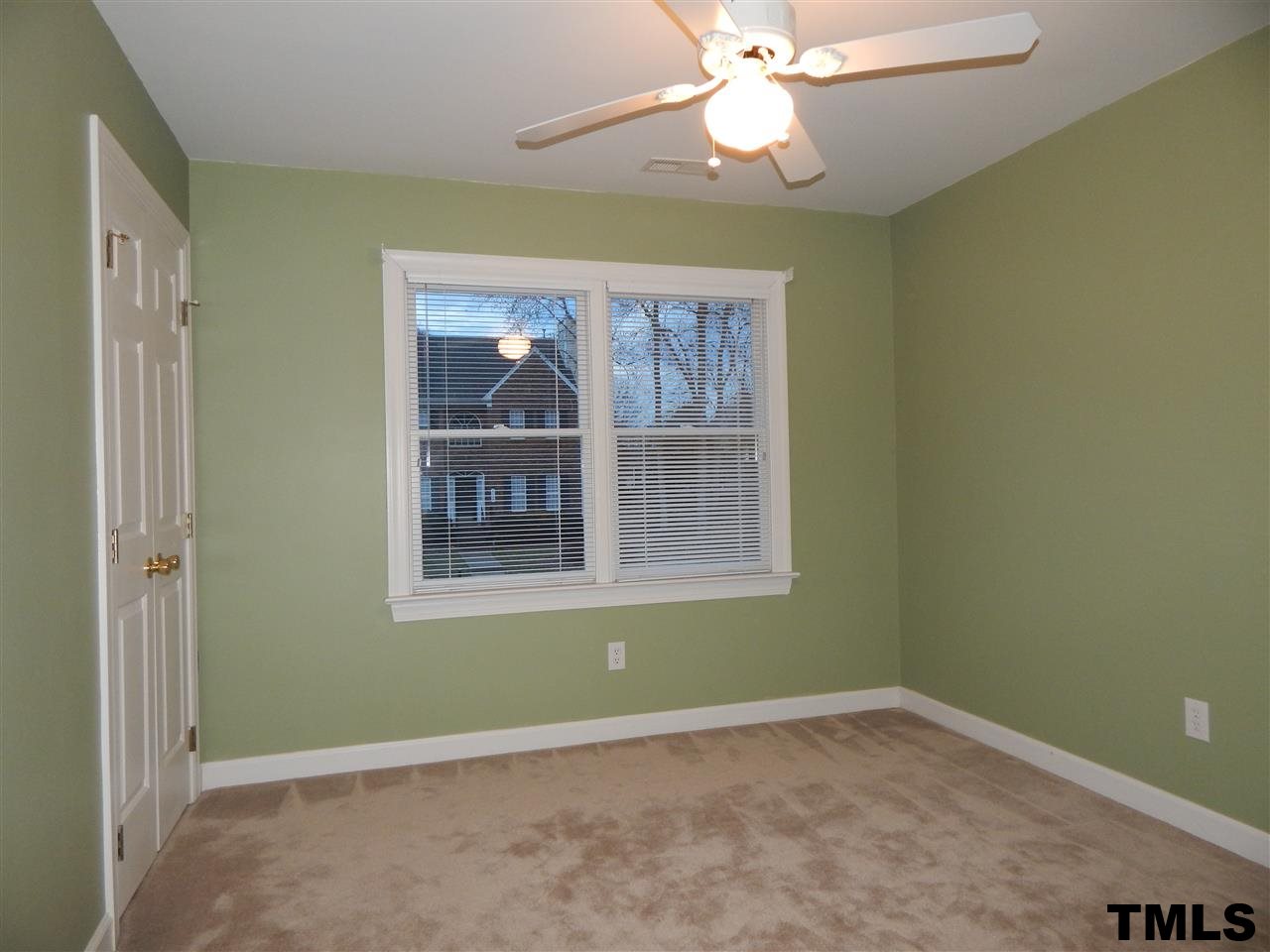 4121 Fowler Ridge Drive Raleigh, NC 27616 - Photo 9 of 20 an empty room with a window and a fan