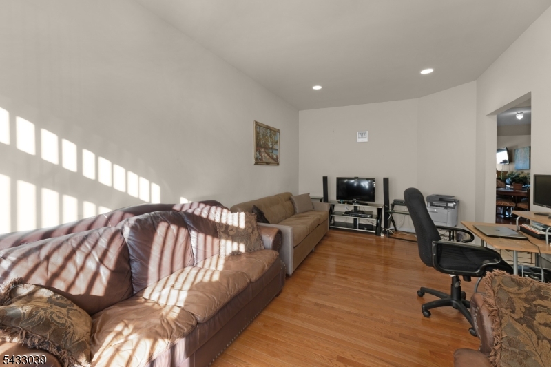 158 Autumn Ridge Road Morris Plains, NJ 07950 - Photo 12 of 26 a bedroom with furniture and a wooden floor