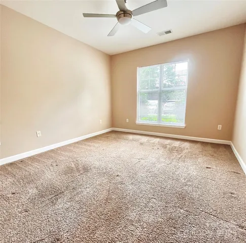 an empty room with closet area