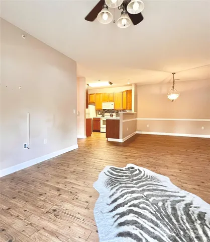 a view of a livingroom with wooden floor