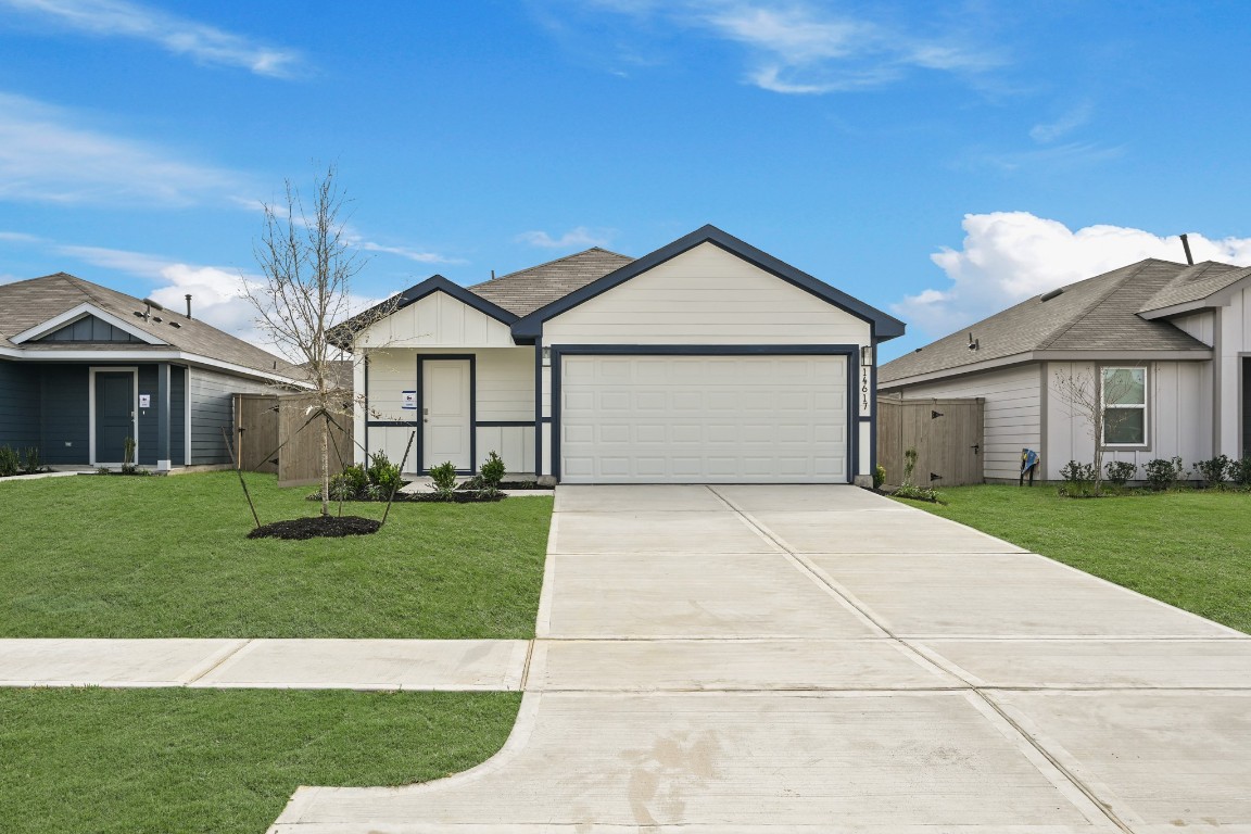 14617 Ivy Floral Way Splendora, TX 77372 - Photo 3 of 27 a front view of a house with a garden
