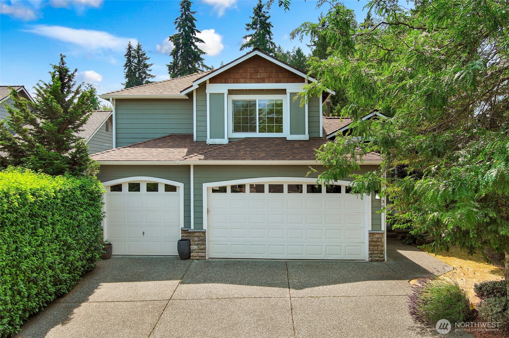 308 170th Place Southeast Bothell, WA 98012 - Photo 40 of 40 a view of a house with a yard and potted plants