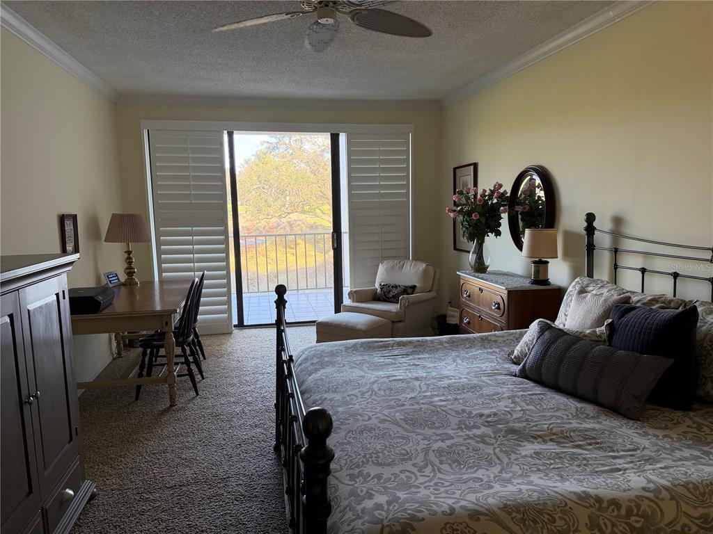 50 Coe Road, Unit 322 Belleair, FL 33756 - Photo 14 of 22 a living room with furniture and large windows