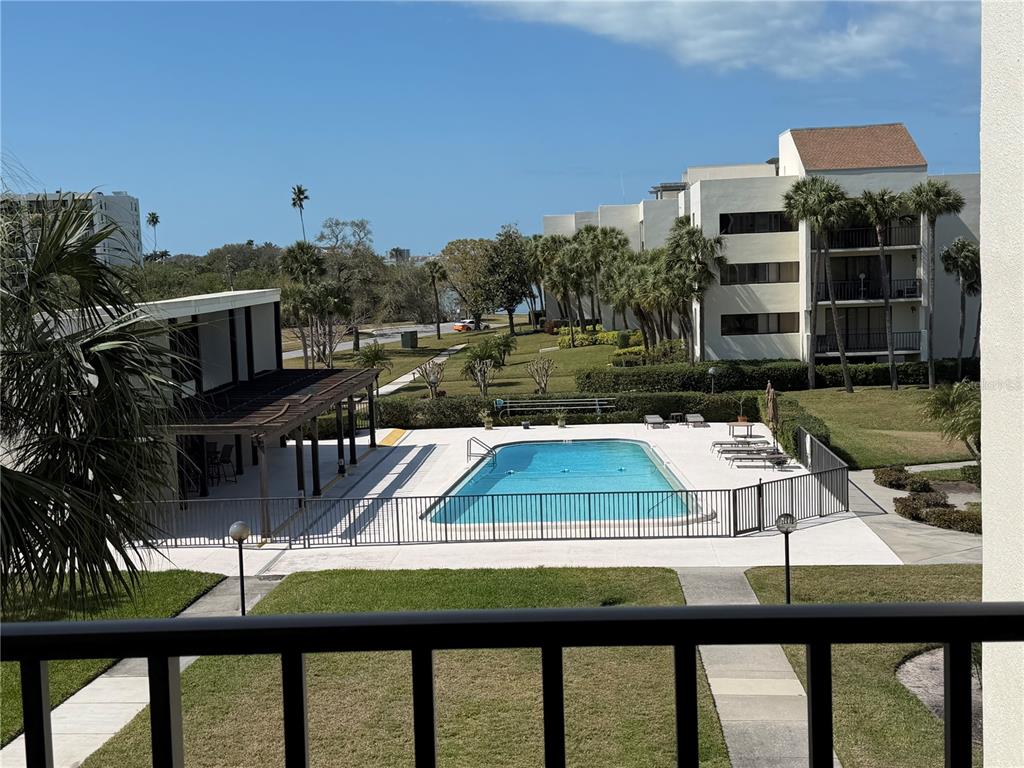50 Coe Road, Unit 322 Belleair, FL 33756 - Photo 17 of 22 a view of swimming pool from a balcony