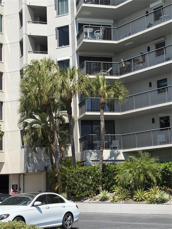 50 Coe Road, Unit 322 Belleair, FL 33756 - Photo 2 of 22 a front view of a building with garden