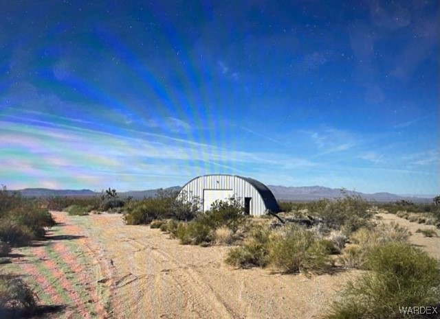 241-17-005 South Horseshoe Road Yucca, AZ 86438 - Photo 1 of 23 a view of a backyard of a house