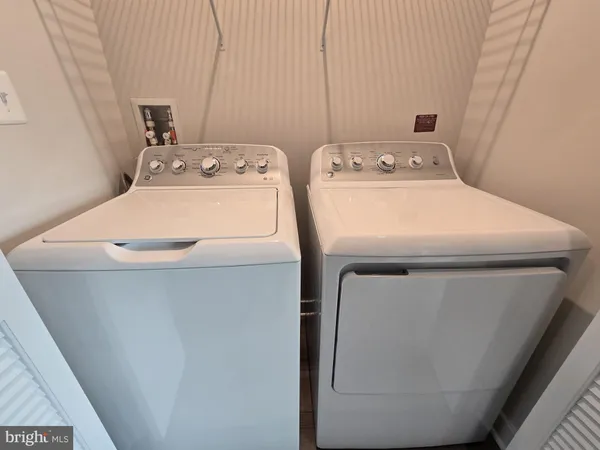 a front view of a house with parking space