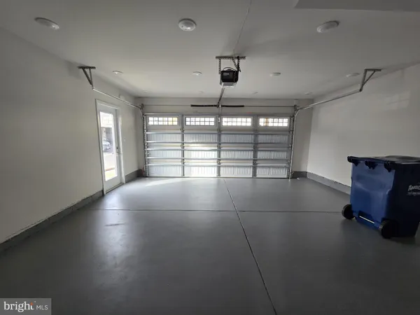 a view of multiple house with car parked