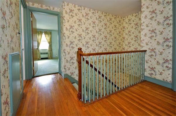 19 Bernard Road Wellesley, MA 02481 - Photo 17 of 24 a view of a hallway view with wooden floor and staircase