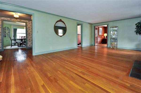 19 Bernard Road Wellesley, MA 02481 - Photo 6 of 24 wooden floor in an empty room with a mirror