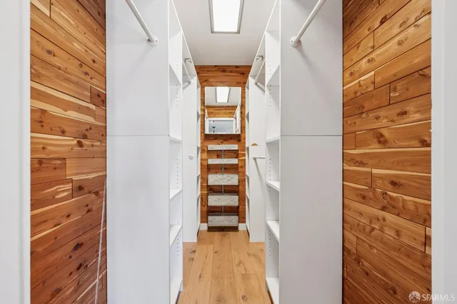 a kitchen with a refrigerator and a stove top oven