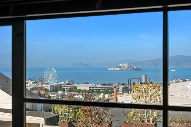 a view of a balcony with wooden floor