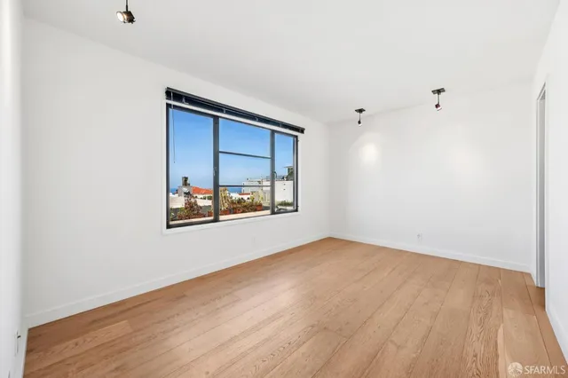 a kitchen with stainless steel appliances a refrigerator stove and microwave