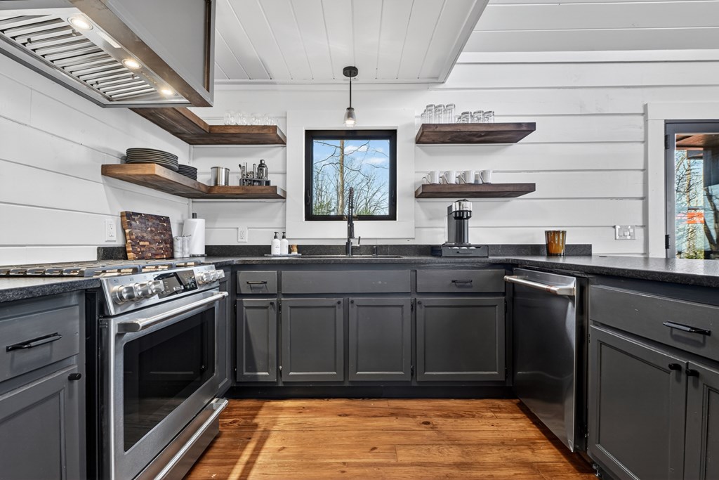 427 Green Ridge Road Blue Ridge, GA 30513 - Photo 15 of 53 a kitchen with stainless steel appliances granite countertop a stove and cabinets