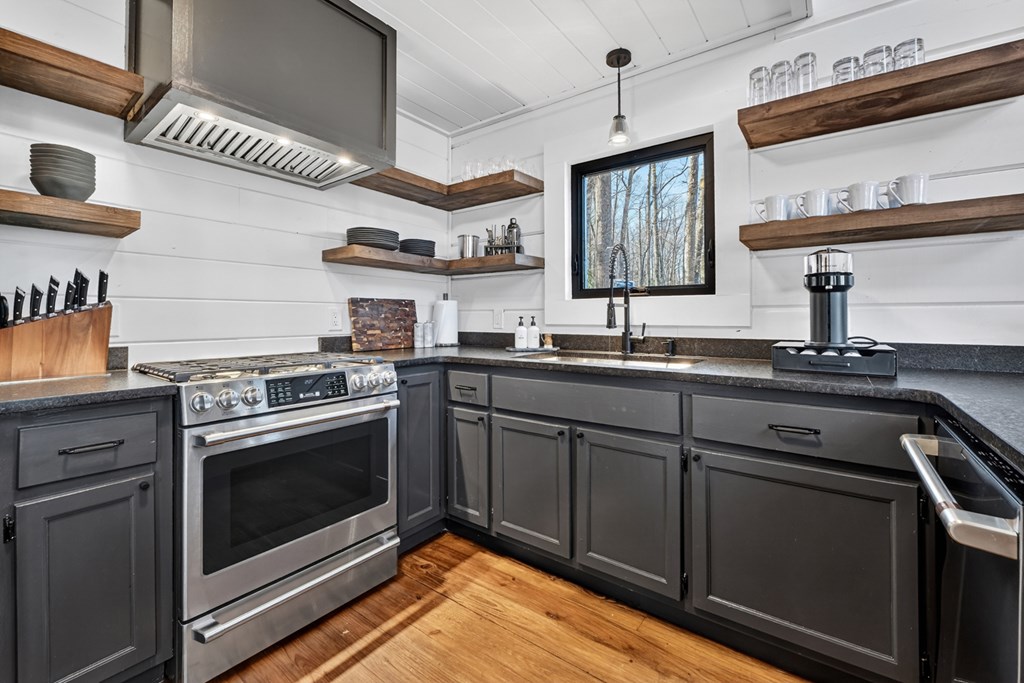 427 Green Ridge Road Blue Ridge, GA 30513 - Photo 16 of 53 a kitchen with stainless steel appliances granite countertop a sink stove and cabinets