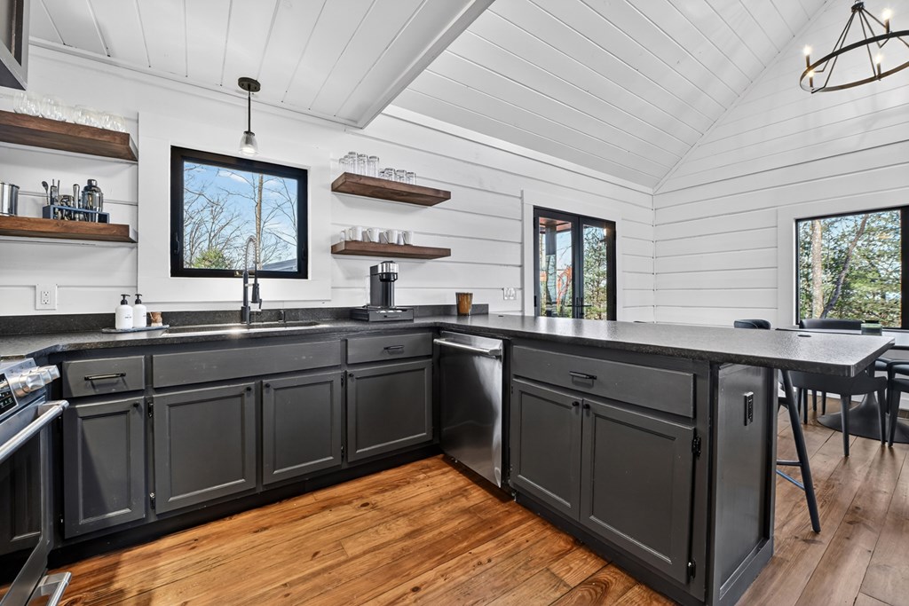 427 Green Ridge Road Blue Ridge, GA 30513 - Photo 17 of 53 a kitchen with a sink appliances and a window