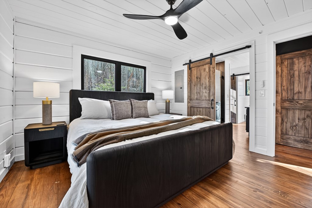 427 Green Ridge Road Blue Ridge, GA 30513 - Photo 20 of 53 a bedroom with bed and wooden floor