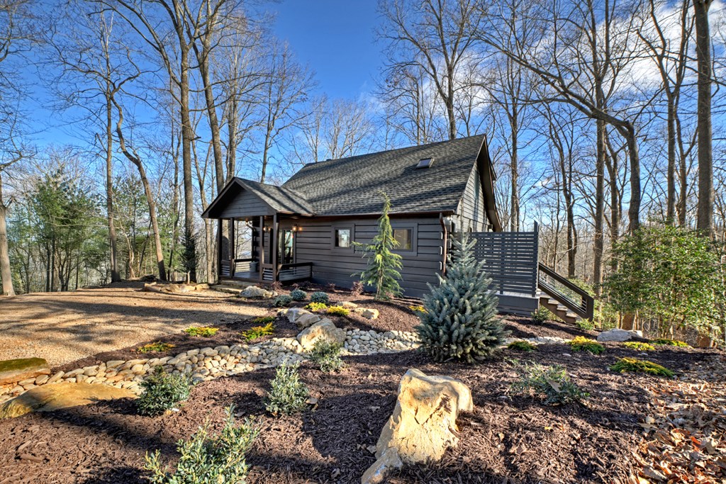 427 Green Ridge Road Blue Ridge, GA 30513 - Photo 37 of 53 a view of a house with backyard and sitting area