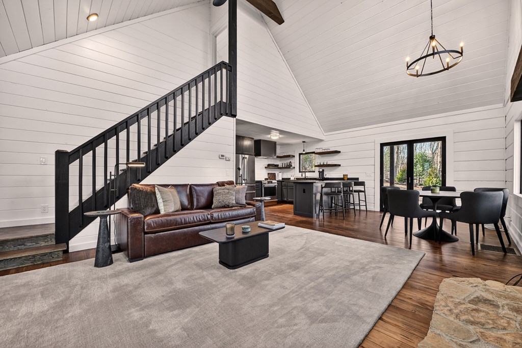 427 Green Ridge Road Blue Ridge, GA 30513 - Photo 9 of 53 a living room with lots of furniture and a chandelier