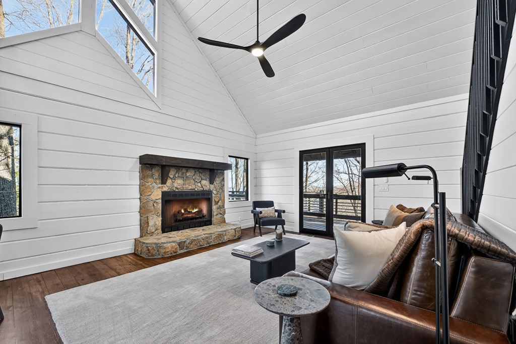 427 Green Ridge Road Blue Ridge, GA 30513 - Photo 10 of 53 a living room with furniture a fireplace and a window