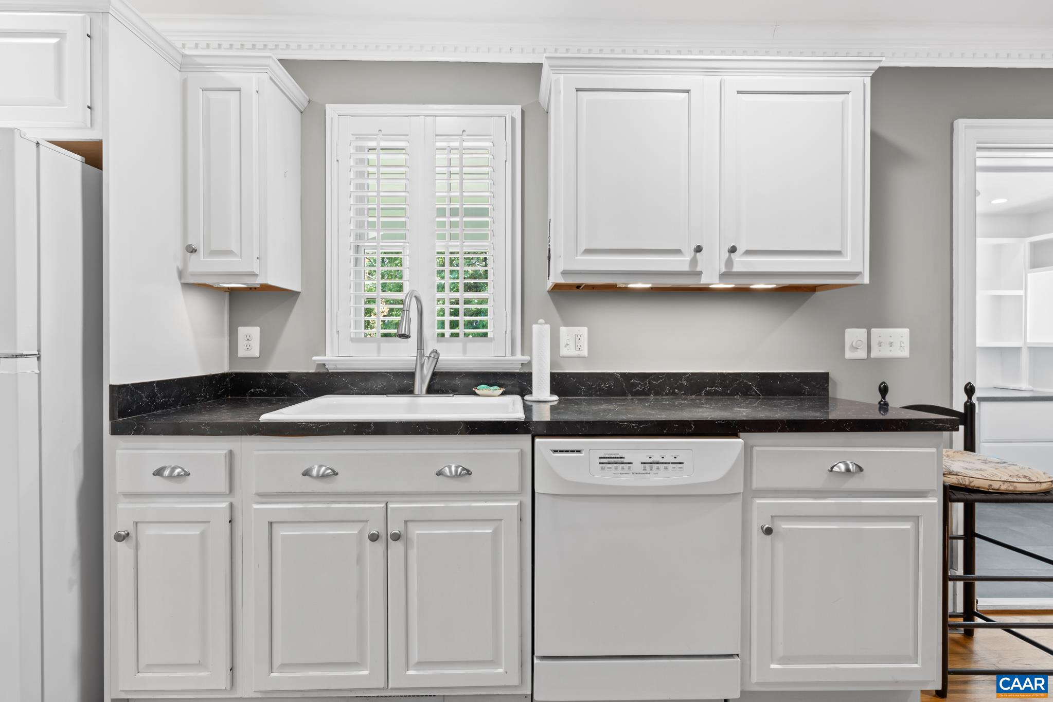 480 Dawsonville Road Barboursville, VA 22923 - Photo 22 of 55 a kitchen with granite countertop white cabinets and a window