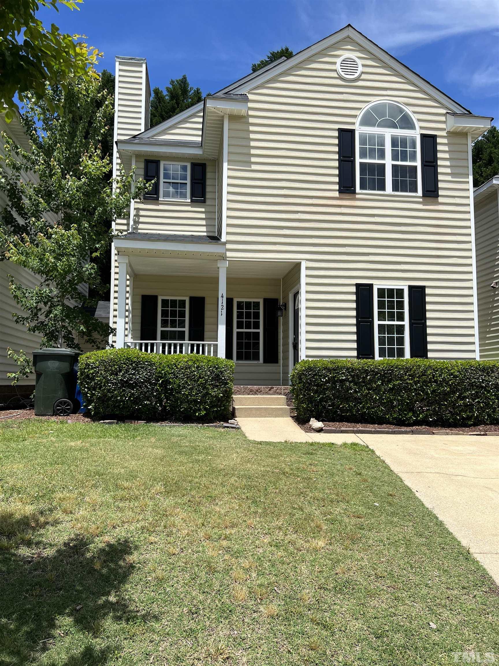 4121 Beaufain Street Raleigh, NC 27604 - Photo 1 of 18 a front view of a house with yard and green space