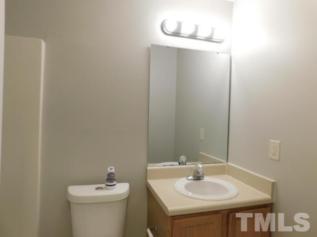 4121 Beaufain Street Raleigh, NC 27604 - Photo 17 of 18 a bathroom with a sink and a toilet