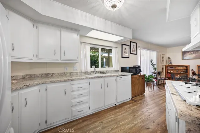 a kitchen with sink cabinets and window