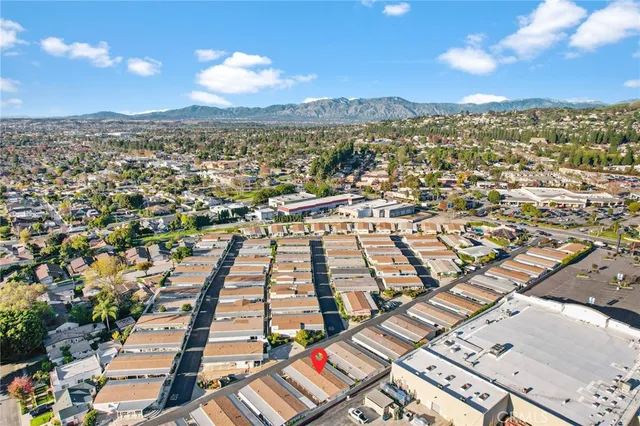 a room with pool table and windows