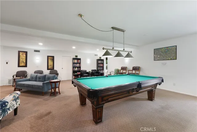 a view of a dining area with furniture and a chandelier