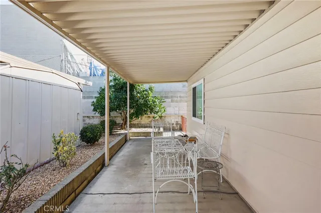 a patio with table and chairs