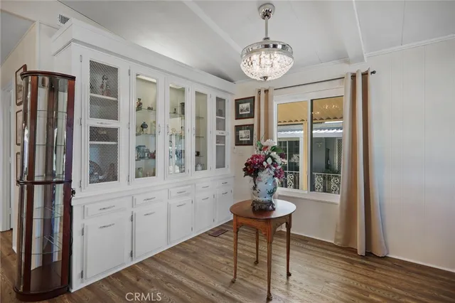 a view of a livingroom with furniture window and wooden floor