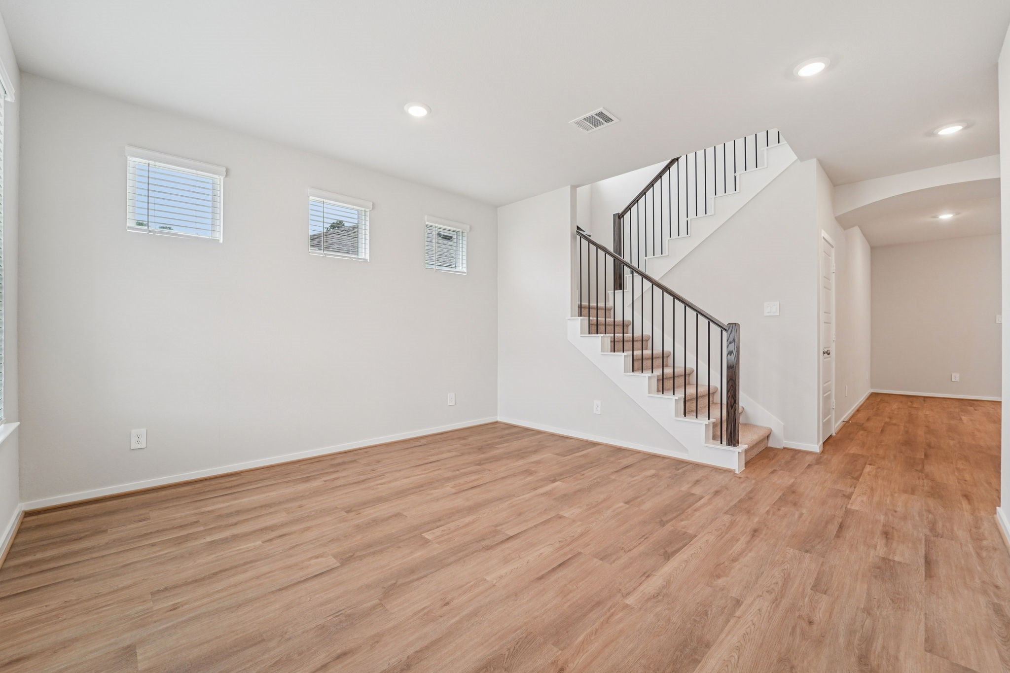 16217 Parish Pointe Court Conroe, TX 77302 - Photo 12 of 42 a view of a hallway with wooden floor and entryway