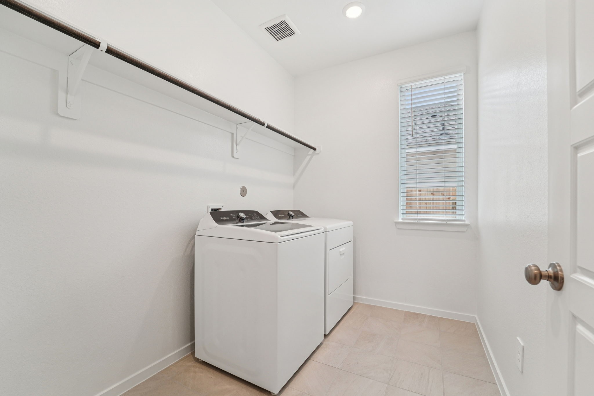 16217 Parish Pointe Court Conroe, TX 77302 - Photo 13 of 42 a utility room with dryer and washer