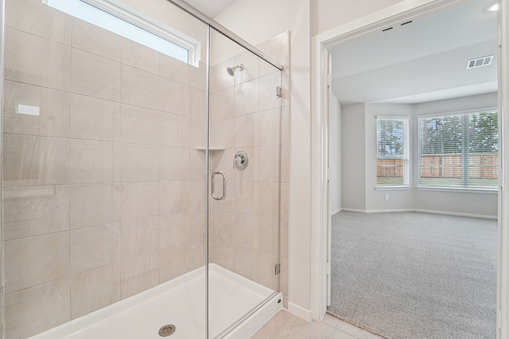 16217 Parish Pointe Court Conroe, TX 77302 - Photo 21 of 42 a bathroom with a shower and a bath tub
