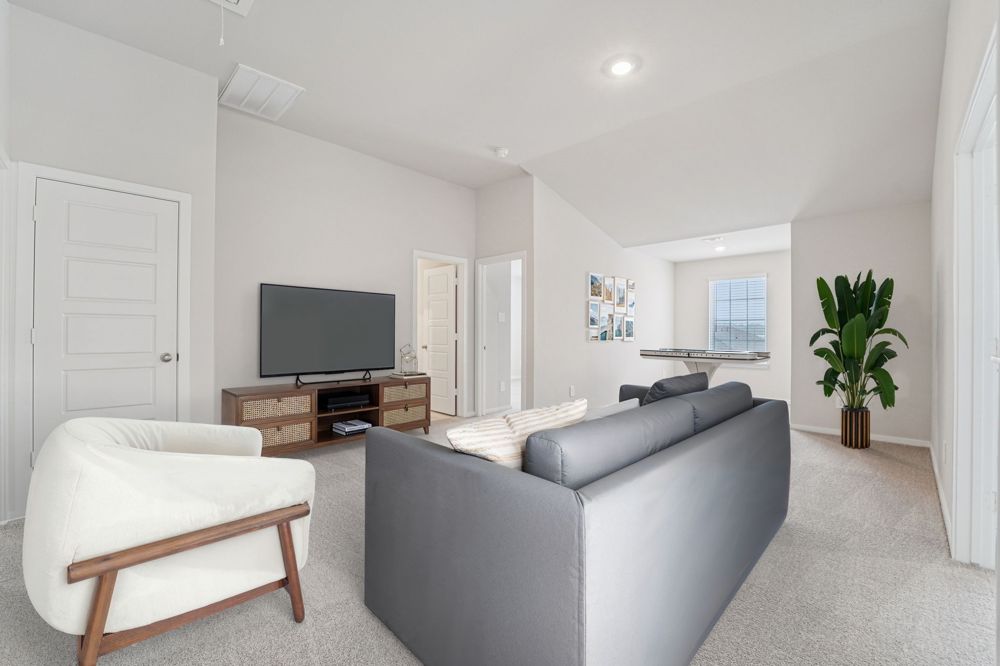 16217 Parish Pointe Court Conroe, TX 77302 - Photo 24 of 42 a living room with furniture and a flat screen tv