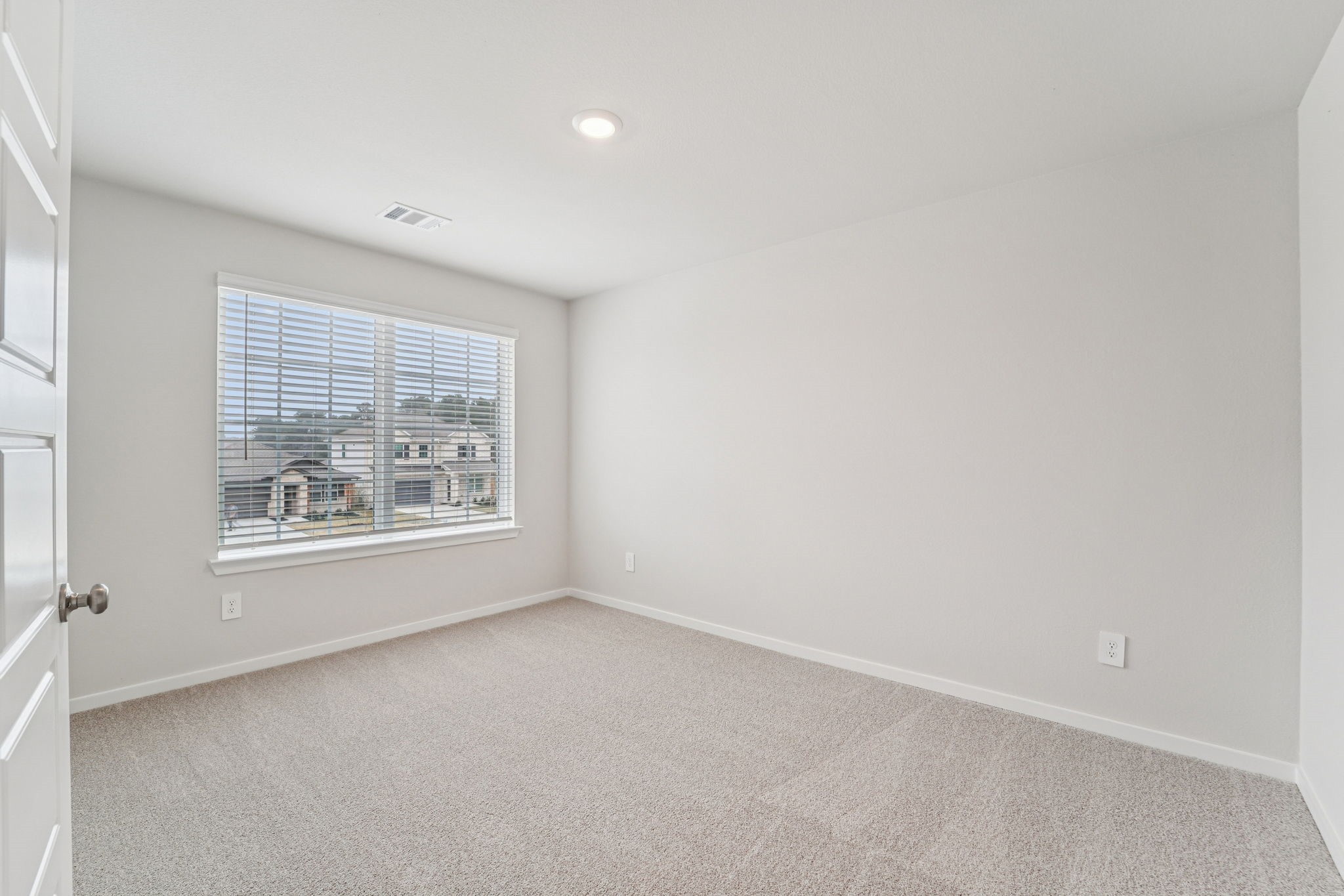 16217 Parish Pointe Court Conroe, TX 77302 - Photo 27 of 42 an empty room with a window