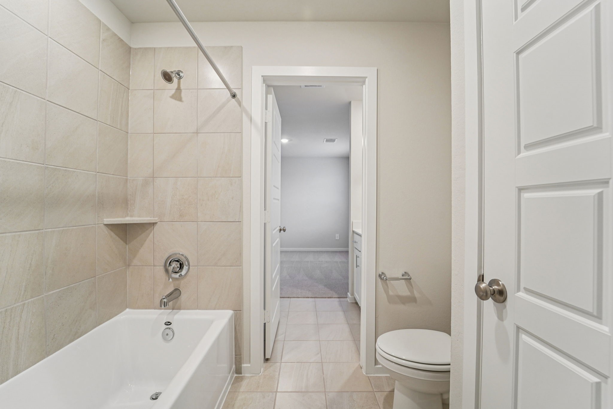 16217 Parish Pointe Court Conroe, TX 77302 - Photo 32 of 42 a bathroom with a bathtub toilet and a shower