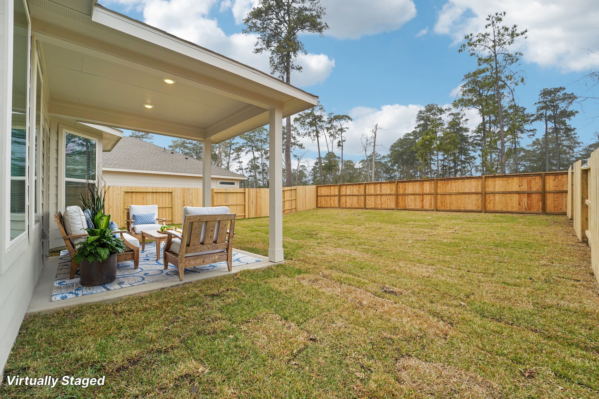 16217 Parish Pointe Court Conroe, TX 77302 - Photo 38 of 42 a lobby with furniture and chandelier