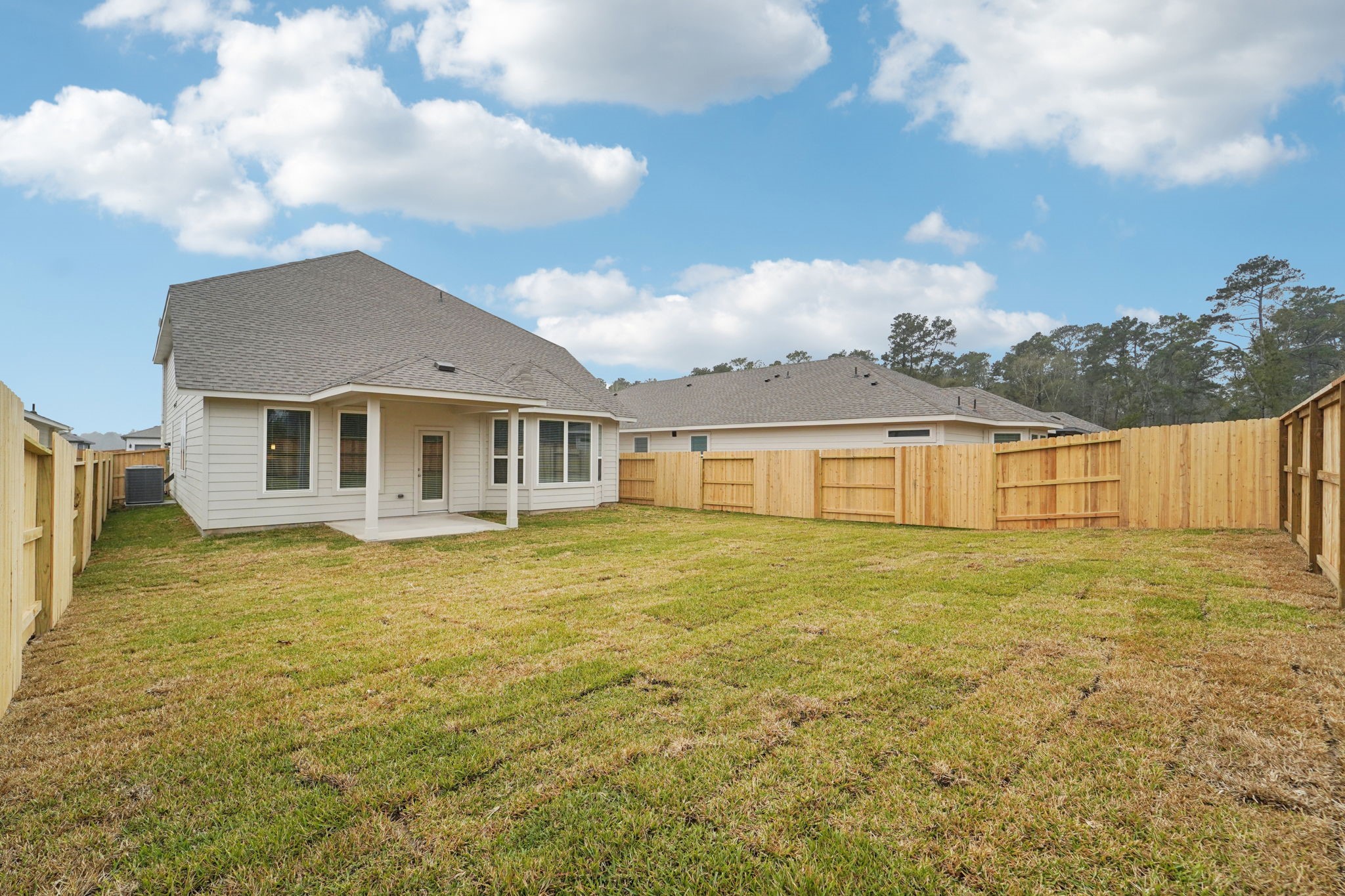 16217 Parish Pointe Court Conroe, TX 77302 - Photo 39 of 42 a front view of a house with a garden