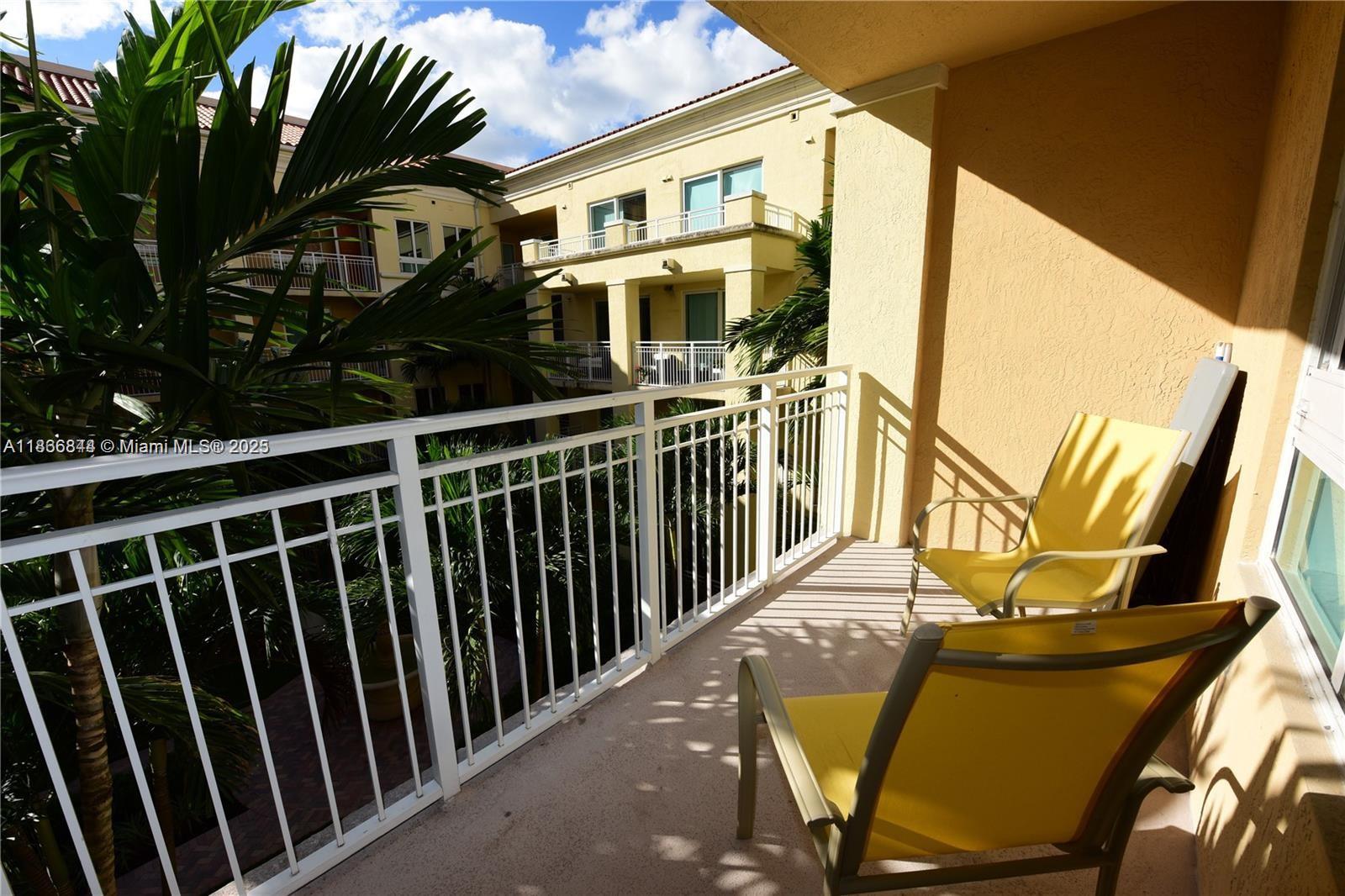 7355 Southwest 89th Street, Unit 622N Miami, FL 33156 - Photo 11 of 16 a view of a balcony with chairs