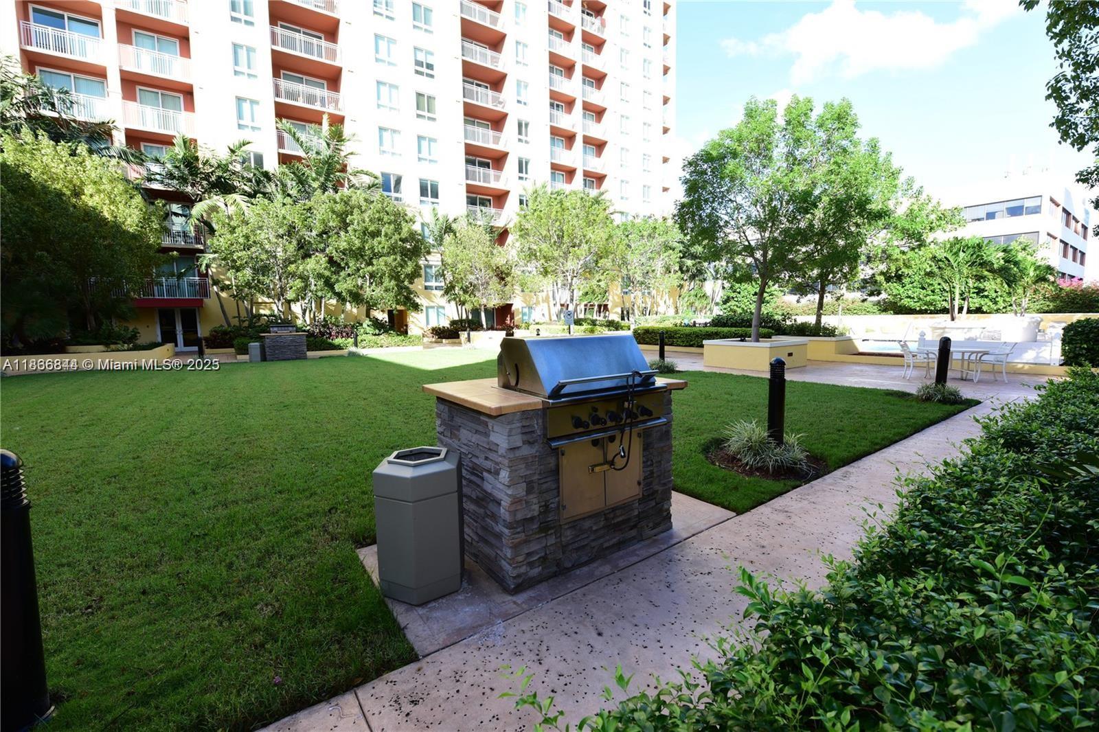 7355 Southwest 89th Street, Unit 622N Miami, FL 33156 - Photo 13 of 16 a garden view with a seating space