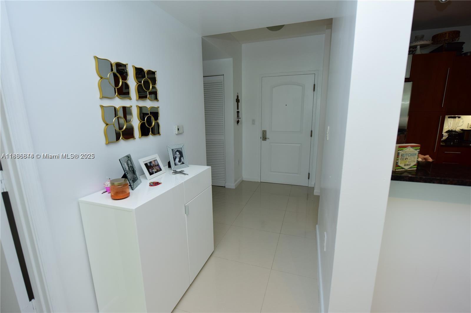 7355 Southwest 89th Street, Unit 622N Miami, FL 33156 - Photo 3 of 16 a utility room with dryer and washer