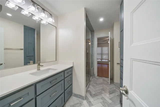 a bathroom with a sink double vanity and a mirror
