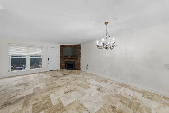 a view of a livingroom with a chandelier fan
